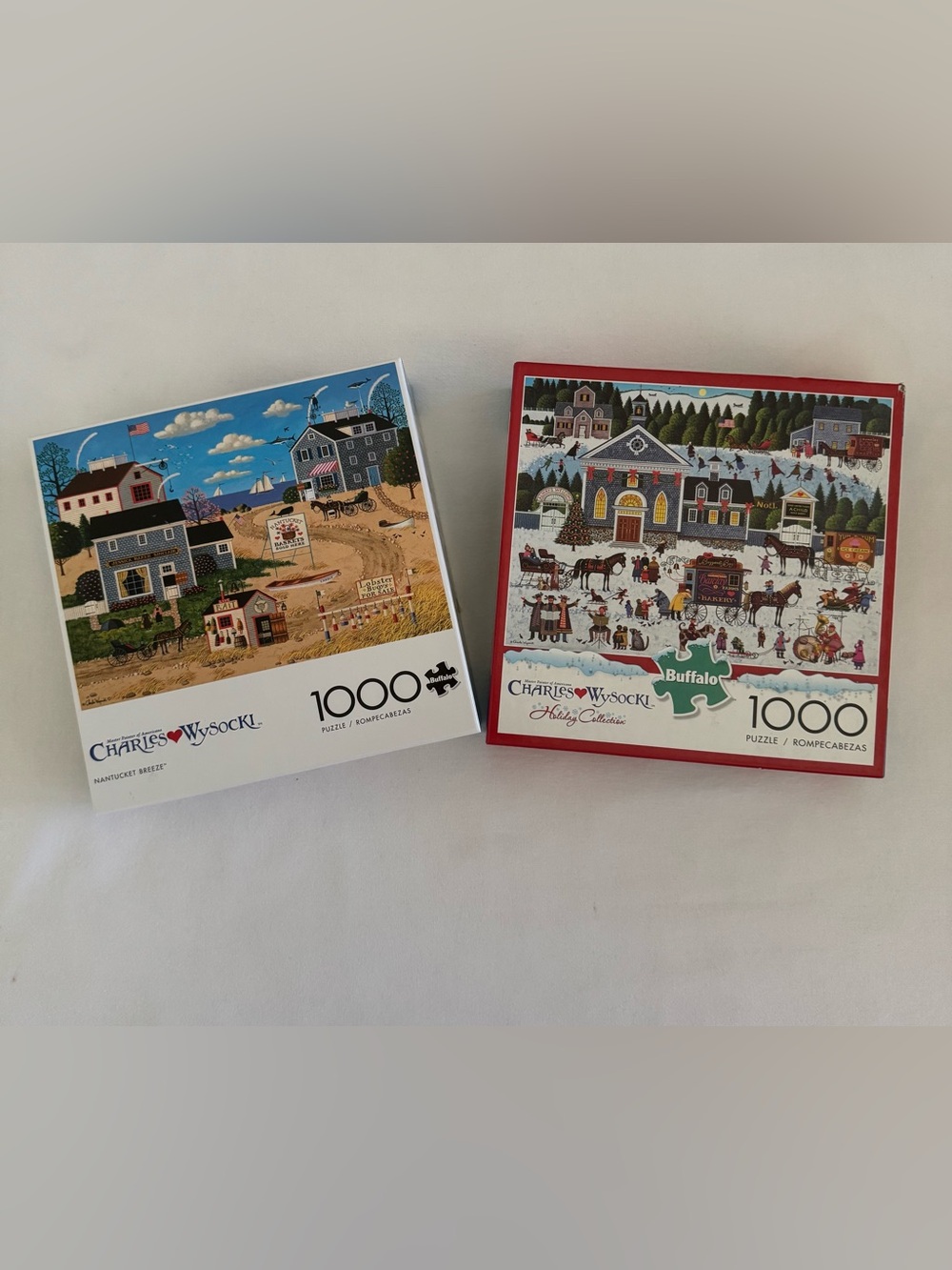 2 Charles Wysocki puzzles, both 1000 pieces.